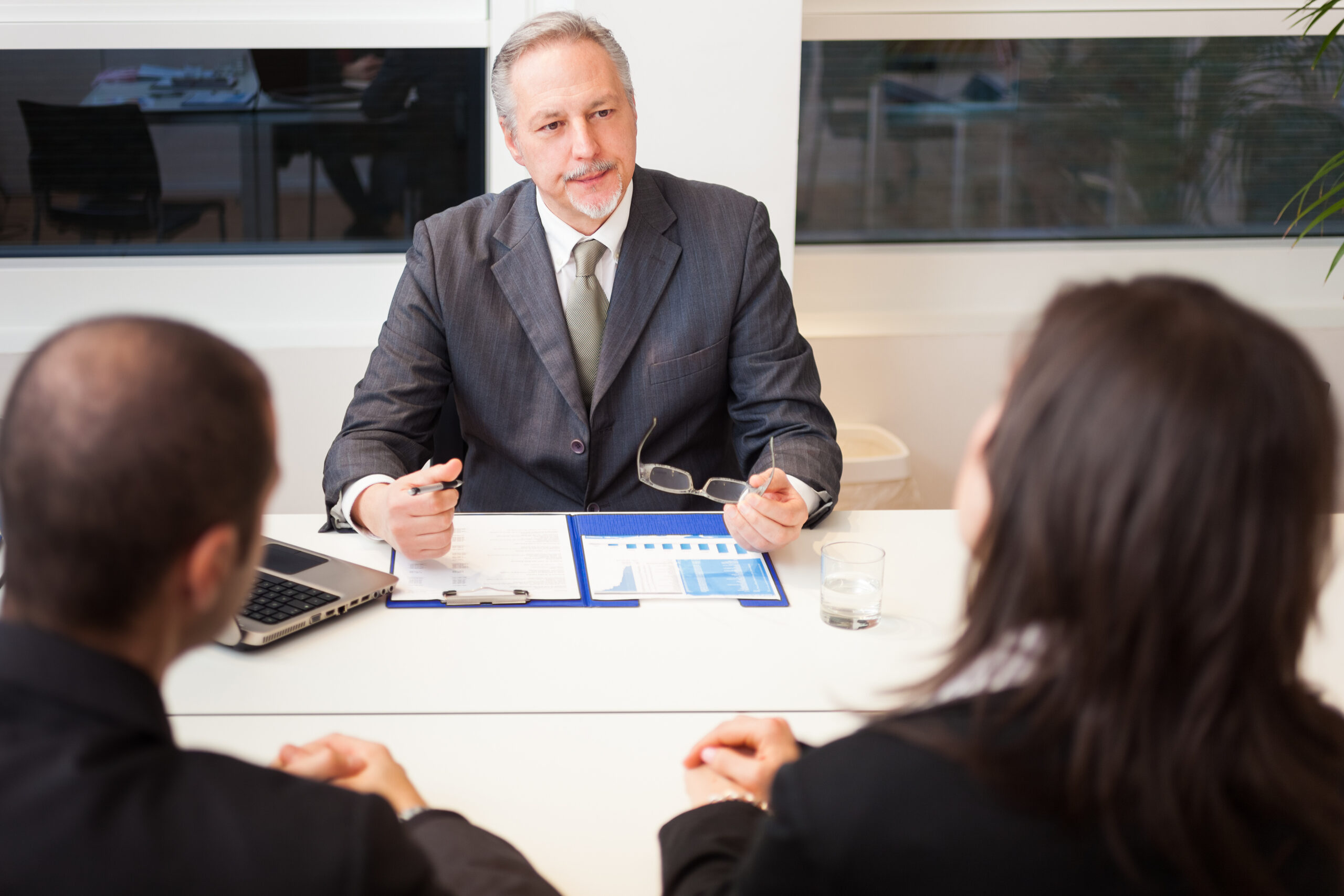 Family lawyer discussing parenting plan with couple.